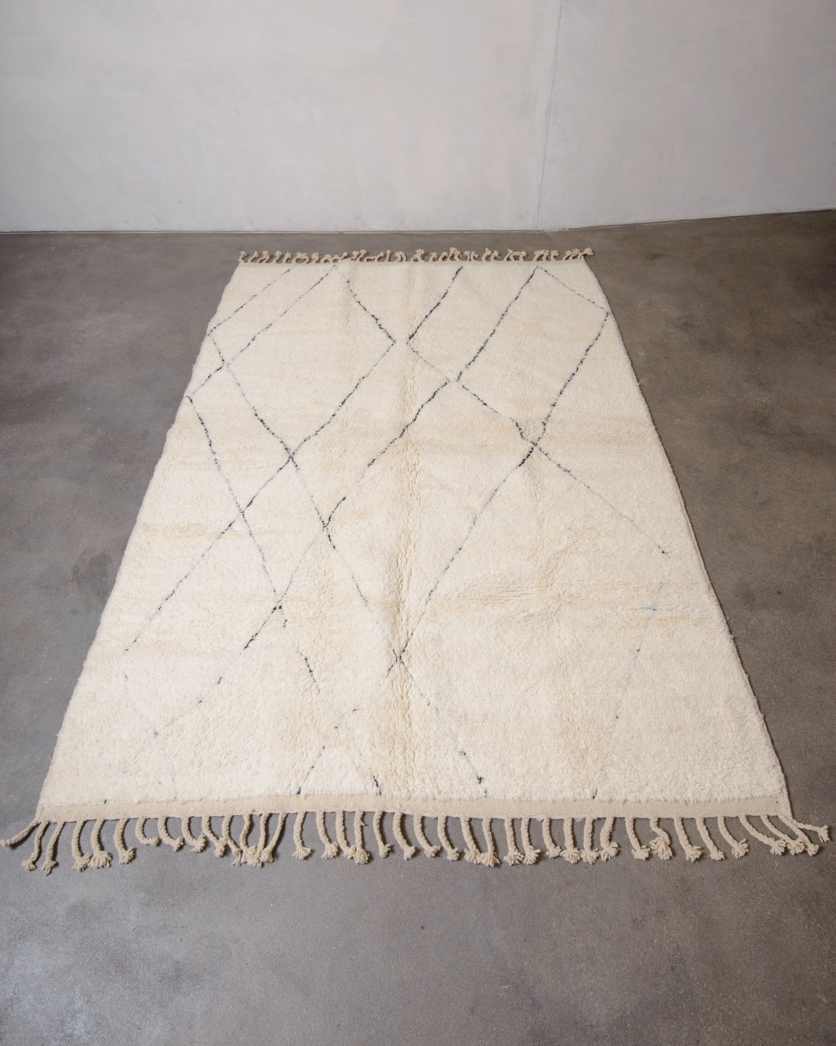 Modern, designer, handcrafted Berber rug from Morocco. Beniourain carpet with minimalist design, natural wool pile and a fluffy texture.